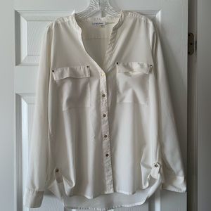 White Calvin Klein blouse.